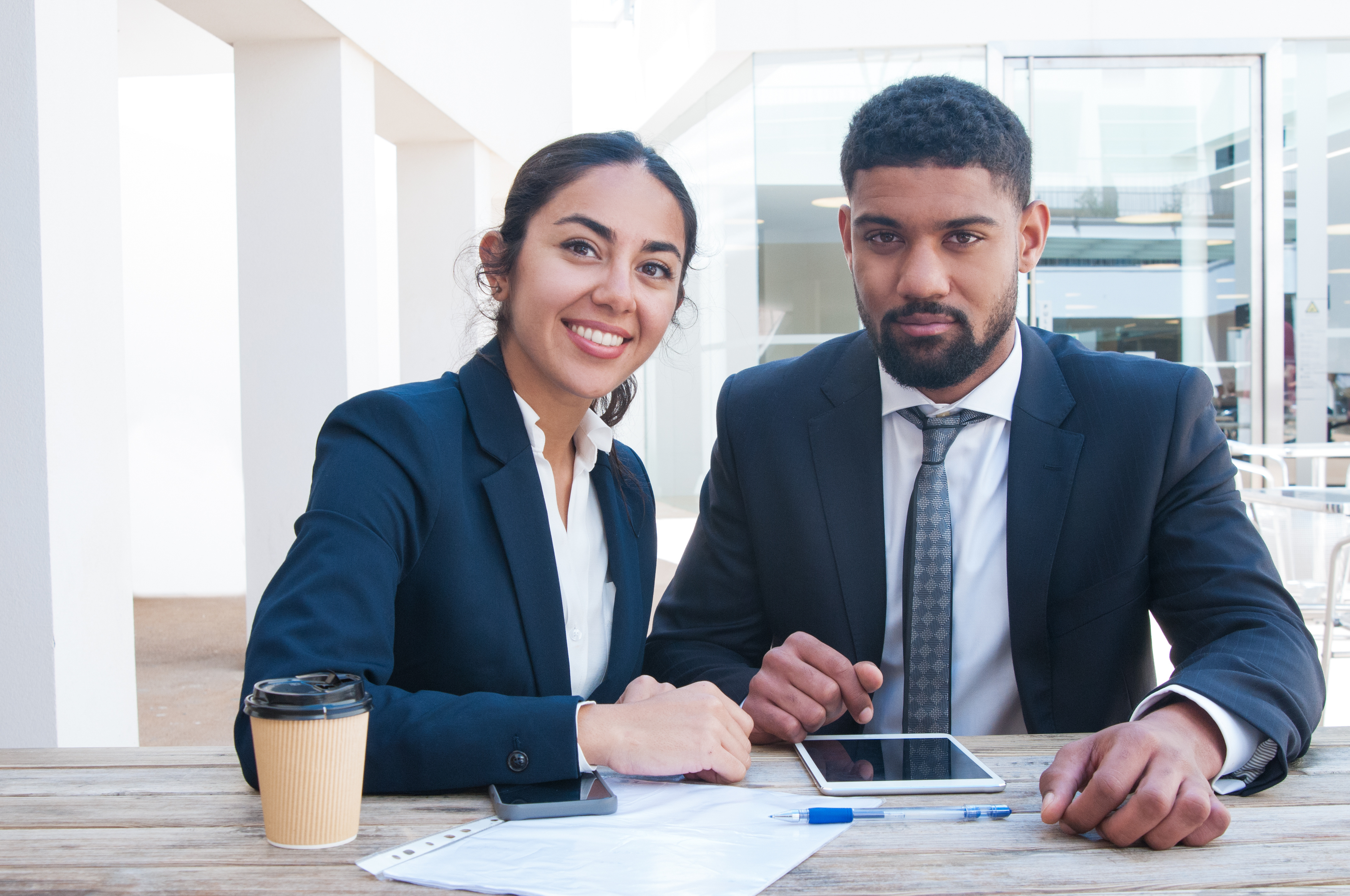 a woman and a man sitting working