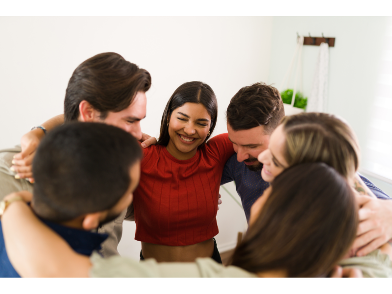 group young people hugging celebrating