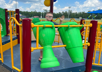 Kid playing with drums on the playground